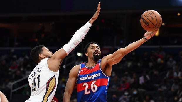 Nov 15, 2021; Washington, District of Columbia, USA; Washington Wizards guard Spencer Dinwiddie (26) shoots as New Orleans Pelicans forward Garrett Temple (41) defends during the first half at Capital One Arena. Mandatory Credit: Brad Mills-USA TODAY Sports